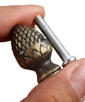 Stylish 2 Piece Kit Of Strawberry Knob Handles In Antique Bronze Finish For Kitchen Cupboards And Vintage Furniture With Screws Included, close-up with screw