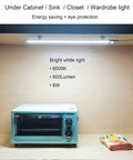 LED Motion Sensor Under Cabinet Lighting Dope 17 Inch USB Plug In Closet Light Bar illuminating a kitchen counter in cool white 6000K.