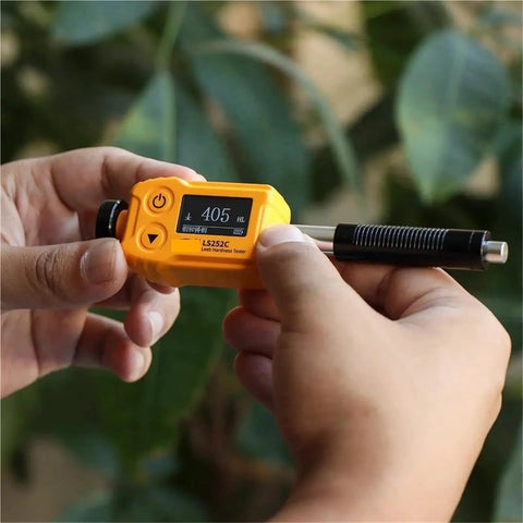 Hassle Free Universal Hardness Tester For Steel Aluminum And Metal Alloys Dead On Accurate Sclerometer Machine Auto Angle Compensation Shop Ready Gauge For Reliable Quality Tests in use, displaying numeric reading.