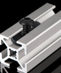 Slide In T Track Nuts 1/4-20 For T Slot Track Kit with 1/4-20 x 1/2 Inch Bolt Black Zinc Finish inserted in aluminum extrusion