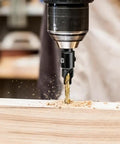 Close-up of Four Piece Diy Woodworking Countersink Drill Bit Set With One Quarter Inch Hex Shank in use on wood