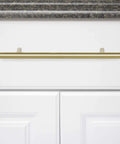 Golden Champagne Euro Bar Cabinet Handle 3/8 Inch Diameter 7-3/8 Inch Length 5 Inch Hole Center mounted on white cabinet