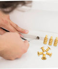 Person using a screwdriver with 24 Pack Zinc Alloy Dowel Pins, Table Leaf Alignment Connectors for quick furniture assembly.