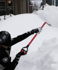 Man using 2 Pack Red D Grip Shovel Handles For 1-1/4 Inch Shovels, Plastic Replacement Grips With 32mm Inner Diameter, Easy Screw-On Install For Digging And Raking Tools on snowy day.