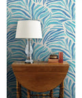 Modern Animal Print Pvc Free Professional Wallpaper Featuring Smooth Matte Linen Finish Built Like A Tank For Busy Households Quick Paste To Paper Install For Your Ultimate Room Refresh with blue and beige design on wall behind wooden table and lamp.