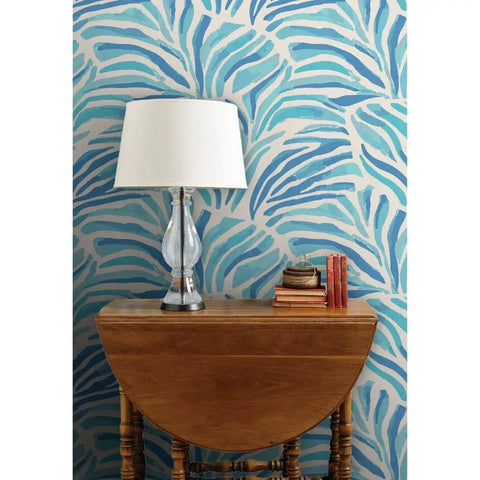 Modern Animal Print Pvc Free Professional Wallpaper Featuring Smooth Matte Linen Finish Built Like A Tank For Busy Households Quick Paste To Paper Install For Your Ultimate Room Refresh with blue and beige design on wall behind wooden table and lamp.