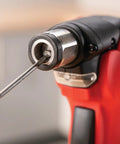 Close-up of Build Ready 12V Brushless Auto Hammer Kit's metal collet with screwdriver bit for compact DIY tasks.
