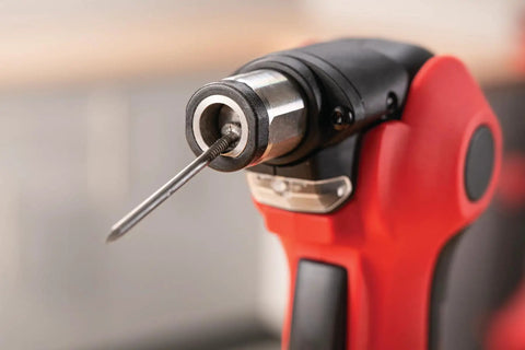 Close-up of Build Ready 12V Brushless Auto Hammer Kit's metal collet with screwdriver bit for compact DIY tasks.