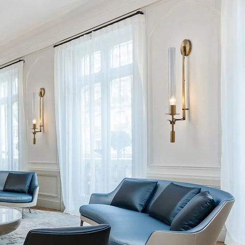 Gold Vintage Wall Sconce with Prismatic Clear Glass Tube (Metal Lamp Body) mounted beside elegant windows.