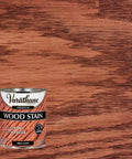 Heavy Duty Interior Wood Stain Delivers A Knockout Red Oak Tone On Cabinets And Furniture While Offering Smooth One Coat Coverage That Does The Heavy Lifting And Locks Raw Wood Grain In One Quart with red oak can on wood background.