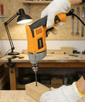 Person using a Corded 720 Watt Drill With Three Eighths Inch Chuck Variable Speed From Zero To Three Thousand Six Hundred RPM Multi Material Drilling For Concrete Metal And Wood With Speed Switch Beast Power For DIY And Pros, drilling into wood