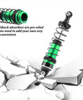 Green aluminum shock absorber cutting through cracked surface, part of Beefed Up Aluminum 87mm Front And Rear Shock Absorber Set