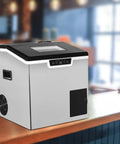 2 in 1 Countertop Ice Maker Crushed Ice and Cube Options Serving Chill with Rock Solid Stainless Steel Build displayed on a bar counter.