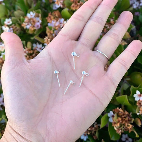 10 Pack Sterling Silver Stud Earrings 4mm Ball Posts With Backs Real 925 Solid Silver Hypoallergenic Nickel Free 0.6 Inch Length 5 Pairs Everyday Sparkle For Sensitive Skin, shown in hand