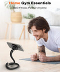 Man using Flexible Gooseneck MagSafe Phone Holder for iPhone Long Arm Gym Mount during home workout on mat.