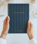 Hands holding blue Daily Planner With Hourly Schedule Spiral Notepad For Easy Tasking And Appointment Organization, Aesthetic To Do List