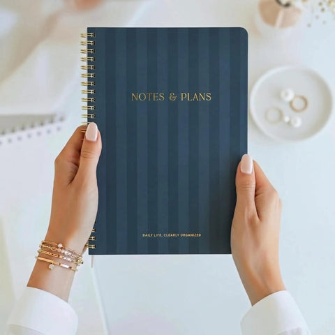 Hands holding blue Daily Planner With Hourly Schedule Spiral Notepad For Easy Tasking And Appointment Organization, Aesthetic To Do List
