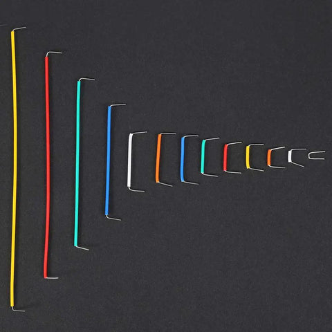 Hassle Free Professional Grade Preformed Jumper Wires With Right Angle Pins For Breadboards And Circuit Prototyping colorful wire kit on dark surface.