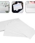 White Self Seal Confidentiality Envelopes 115mm By 225mm For Office Documents And Shipping, 50 pack displayed on table