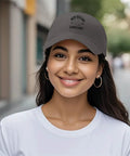 New Orleans Inspired Dark Grey Adjustable Cap For Men With One Size Fits Most Comfy Buckle Closure, worn on a woman's head