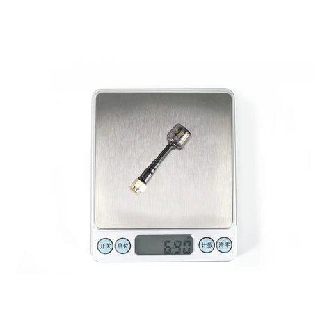 60mm RHCP SMA FPV antenna for RC Drones, 5.8GHz, on digital scale showing 6.9g weight, blue shell, ultra durable signal