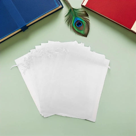 Stack of White Organza Gift Bags 100 Pack Drawstring Candy Bags For Party Favors And Wedding Decor Clear Sheer Mesh