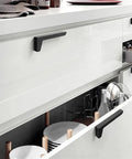 Dope Brushed Gold Cabinet Handles 64mm Drawer Pulls for wardrobes and furniture on a sleek white kitchen cabinet