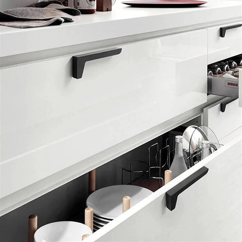 Dope Brushed Gold Cabinet Handles 64mm Drawer Pulls for wardrobes and furniture on a sleek white kitchen cabinet
