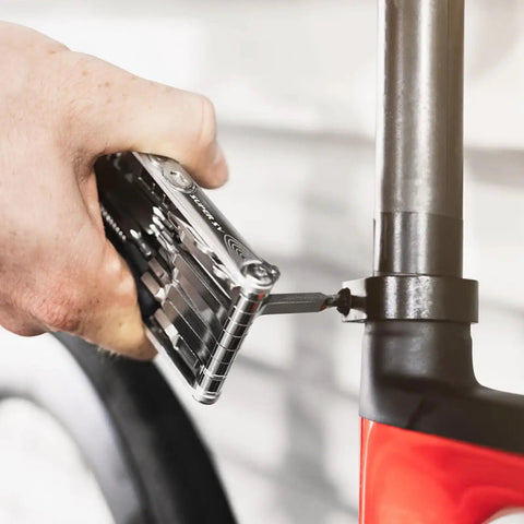 Using Go To All In One Bike Repair Tool With Tubeless Kit And Chain Breaker on a bike, showing tool application