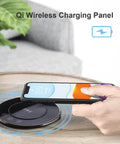 Total Game Changer Smart Motorized Pop-Up Power Station Featuring Six Ac Outlets, Four Usb Ports, Qi Wireless Charging Pad, Ip65 Waterproof Glass Top, Built In Speaker, And Adjustable Led Lamp For Your Sweet Home Office Setup with phone charging on panel.