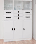 White cabinet with Black Leather Drawer Pulls 2 Piece Set Measuring 7 7/8 By 1 1/2 Inches Leather Handles installed on drawers.