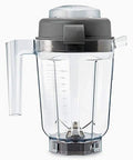 Clear 32 oz dry grains container with reverse-vortex blades, BPA-free, for grinding whole grains into fresh flour, batter, and dough.