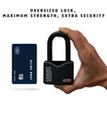 Hand holding Granit Alloy Steel Padlock with 2 Inch Shackle, Keyed Alike, next to credit card for size comparison