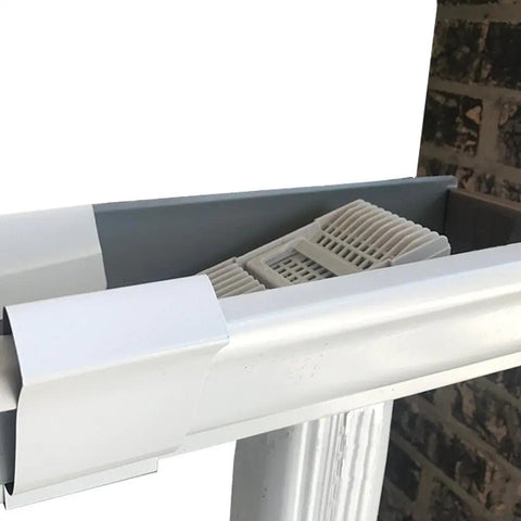 Close-up of Wedge Downspout Guard 2 Pack That Prevents Clogged Downspouts From Leaves And Debris Reduces Gutter Cleanouts installed
