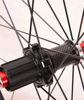 Close-up of Road Bike Wheelset 700C With Carbon Fiber Hubs, Dope Double Wall Alloy Rims, showing detail of rear hub and spokes