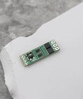 Close-up of Two Pack Micro Brushless ESC 8A Electronic Speed Controller Module For 1S To 3S Batteries on a gray surface.