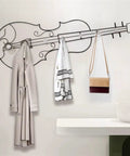 Modern Wall Mount Coat Hooks Dang Handy Entryway Storage Rack Easily Hangs Coats Jackets And Keys With Heavy Duty Steel Frame Built For Everyday Grind At Home, artistic violin design with coats and bag.
