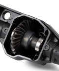 Close-up of Overdrive And Underdrive Helical Axle Gear Set Upgrade for Axial RC Crawlers showing gear teeth detail and housing.