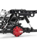 Close-up of a black chassis with red differential for an RC crawler, featuring 4 Pack 120mm RC Shock Absorbers With Internal Springs.