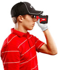 Golfer using Go-To Golf Laser Rangefinder With Slope Mode And 7X Magnification, Delivers Pin-High Distances Up To 1200 Yards