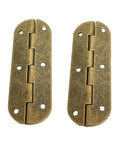 Close-up of a brass barrel hinge set for cabinet doors and countertops with screws, showing two classic durable hinges.