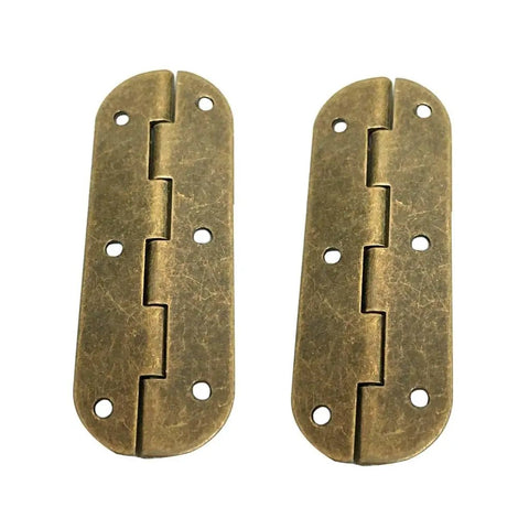 Close-up of a brass barrel hinge set for cabinet doors and countertops with screws, showing two classic durable hinges.