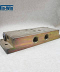 Waterjet hydraulic manifold block, top-mount, angled side view; metal with multiple threaded ports; Win-Win logo visible