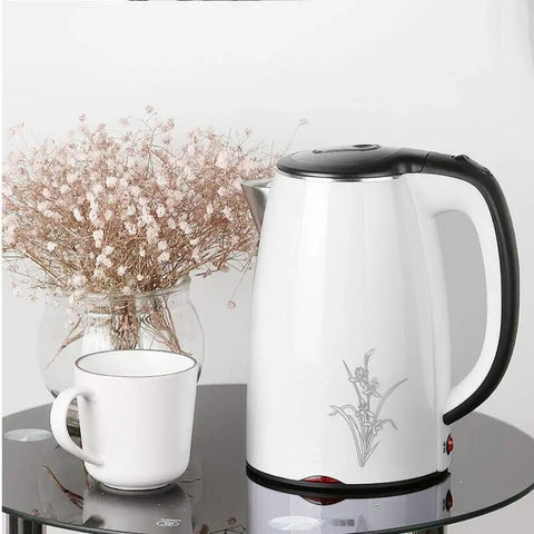 Heavy Duty 304 Stainless Steel Electric Kettle 1.7 Liter 1830 Watt Kicking Boils Fast cordless on table with white cup.
