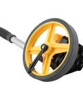 Measuring Wheel with Foldable Telescopic Handle, 0-9999.9m Range, yellow wheel and gray handle, designed for accurate distance measurement.