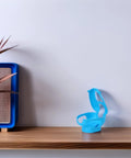 Pro Grade Pigeon Injection Holder For Easy Medicine Feeding, Lock In Bird Holder Frame shown on wooden shelf, blue color