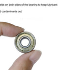 Close-up of a 608-ZZ ball bearing with double metal shielding, part of a pack of 50 for skateboards and scooters for smooth rolling.