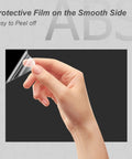 Hand peeling protective film from Two Pack Black ABS Plastic Sheets 8 By 12 Inches One Eighth Inch Thick Moldable Material For DIY Home Decor Handcraft Projects And Structural Crafts With High Tensile And Impact Resistance.