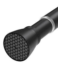 Close-up of Black Tension Curtain Rod 28 To 48 Inch No Drill Adjustable Spring Rod with skid-resistant base.
