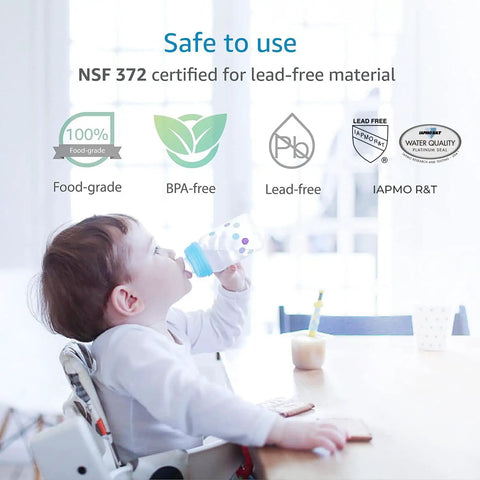 Infant drinking from safe, NSF 372 certified, BPA-free, lead-free bottle at table.